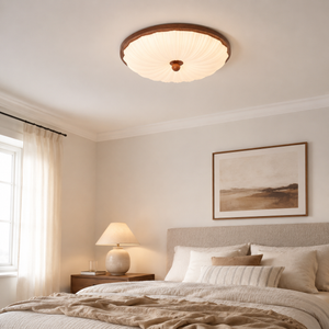 walnut pattern acrylic ceiling light in a bright bedroom with framed wall art