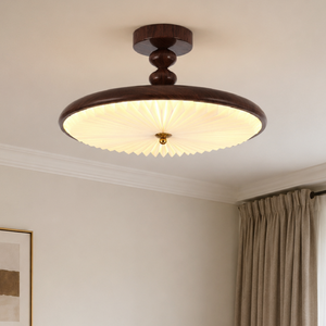 walnut pleated ceiling light on a ceiling with pleated shade close-up