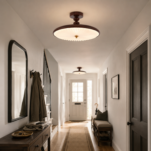 walnut pleated ceiling light lighting a narrow hallway