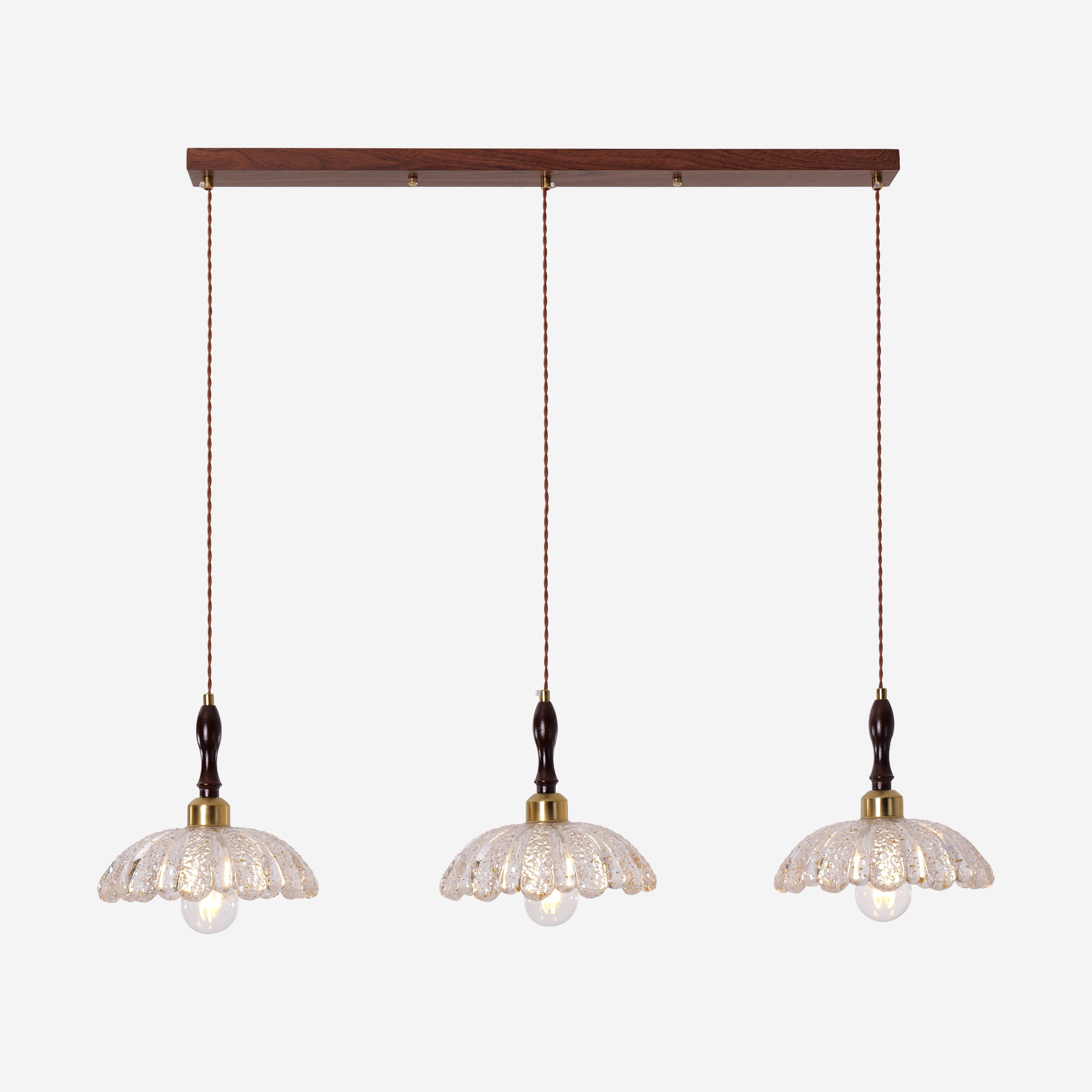 3-light walnut resin mini pendant in a warm living room