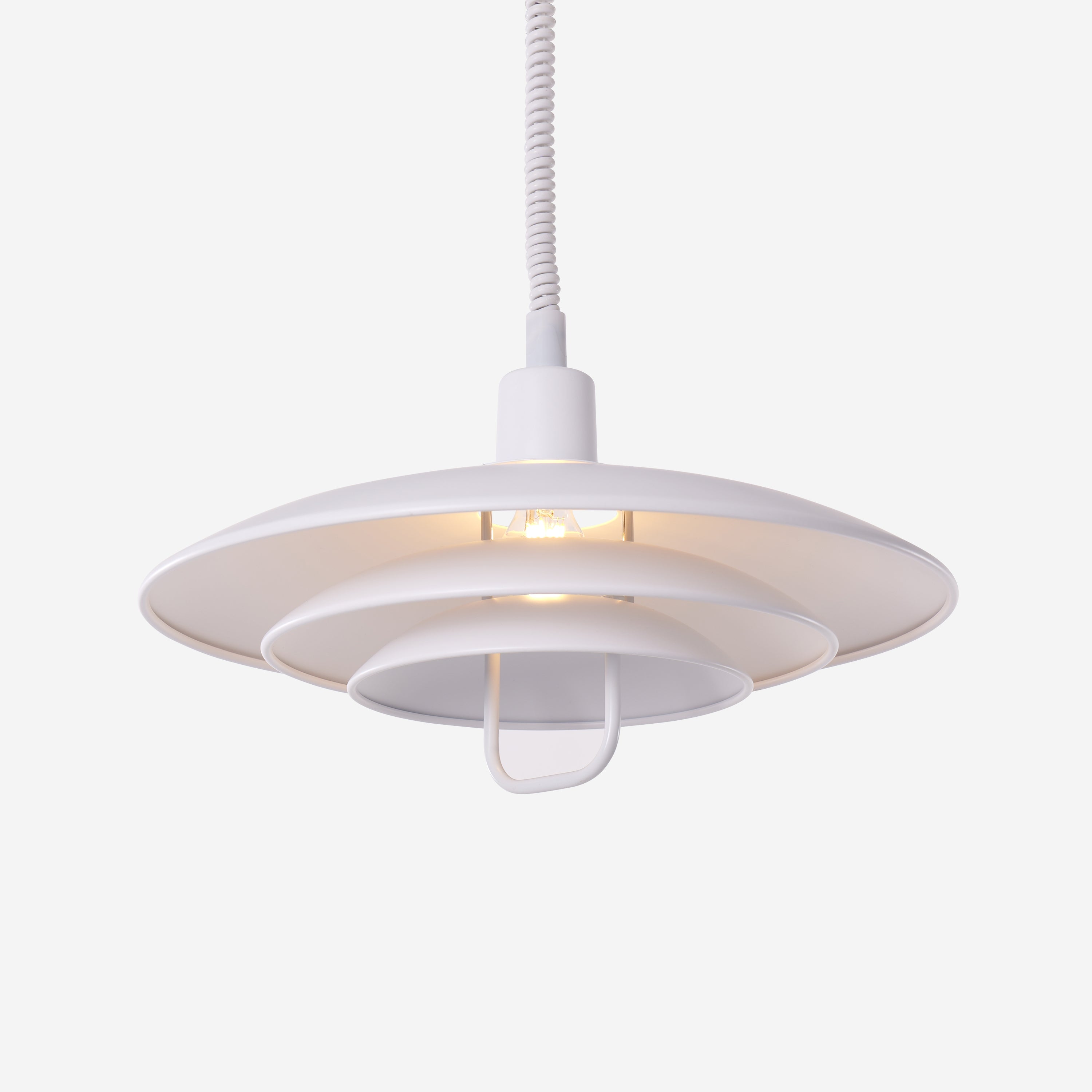 white layered minimalist pendant light over a kitchen island
