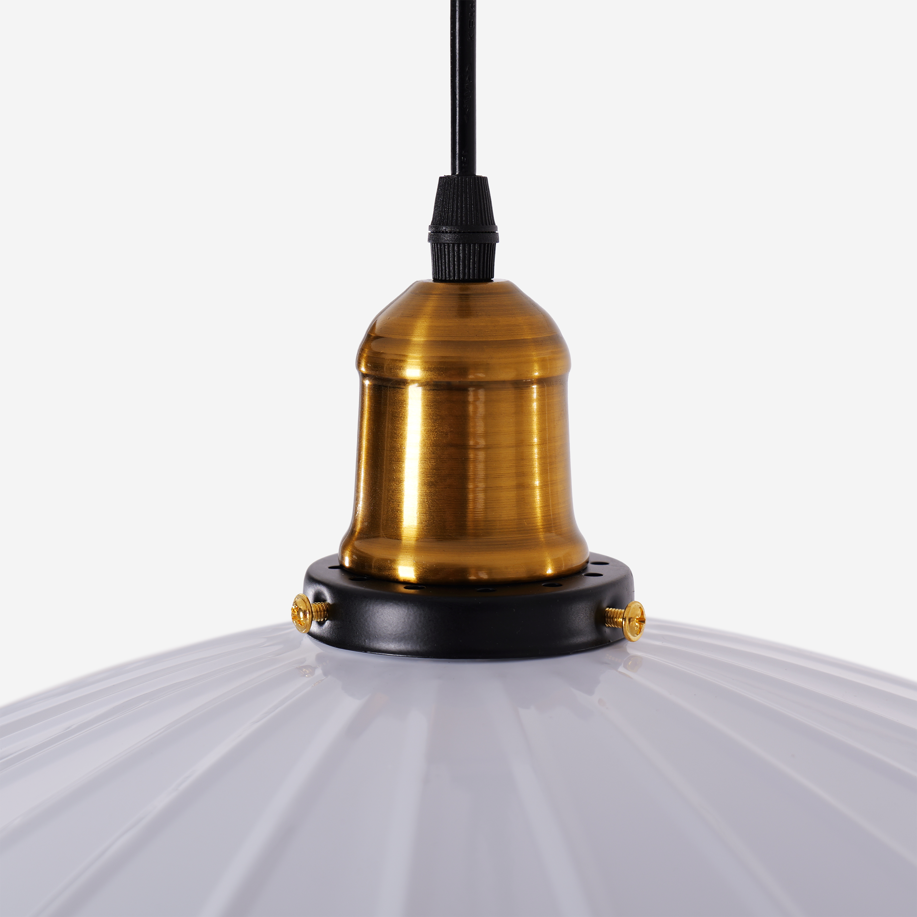 white iron pendant light beside a cosy seating area