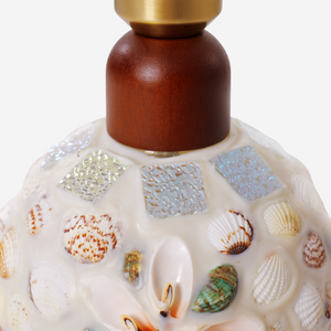 seashell mosaic table lamp styled on a small side table