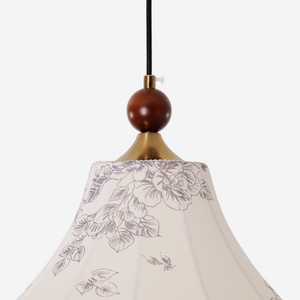 yellow floral fabric pendant light adding warm light to a dining space