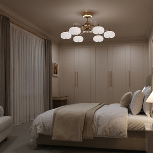 Copper ceiling fan light casting cool white light in a modern bedroom