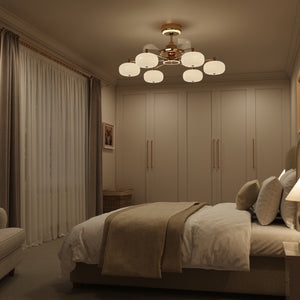 Copper acrylic ceiling fan light with soft warm glow over a beige bedroom