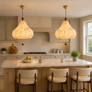 yellow floral fabric pendant light hung above a dining table