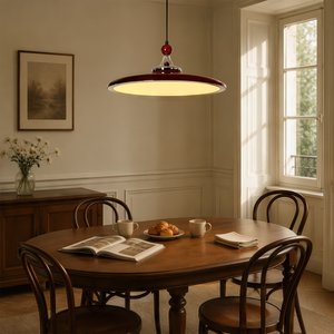 red iron pendant light over a kitchen island