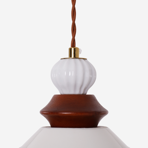 brown ceramic lace pendant light beside a cosy seating area