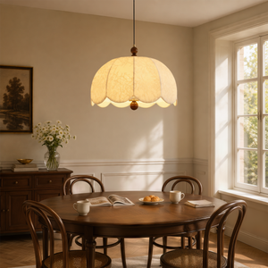yellow fabric pendant light beside a cosy seating area
