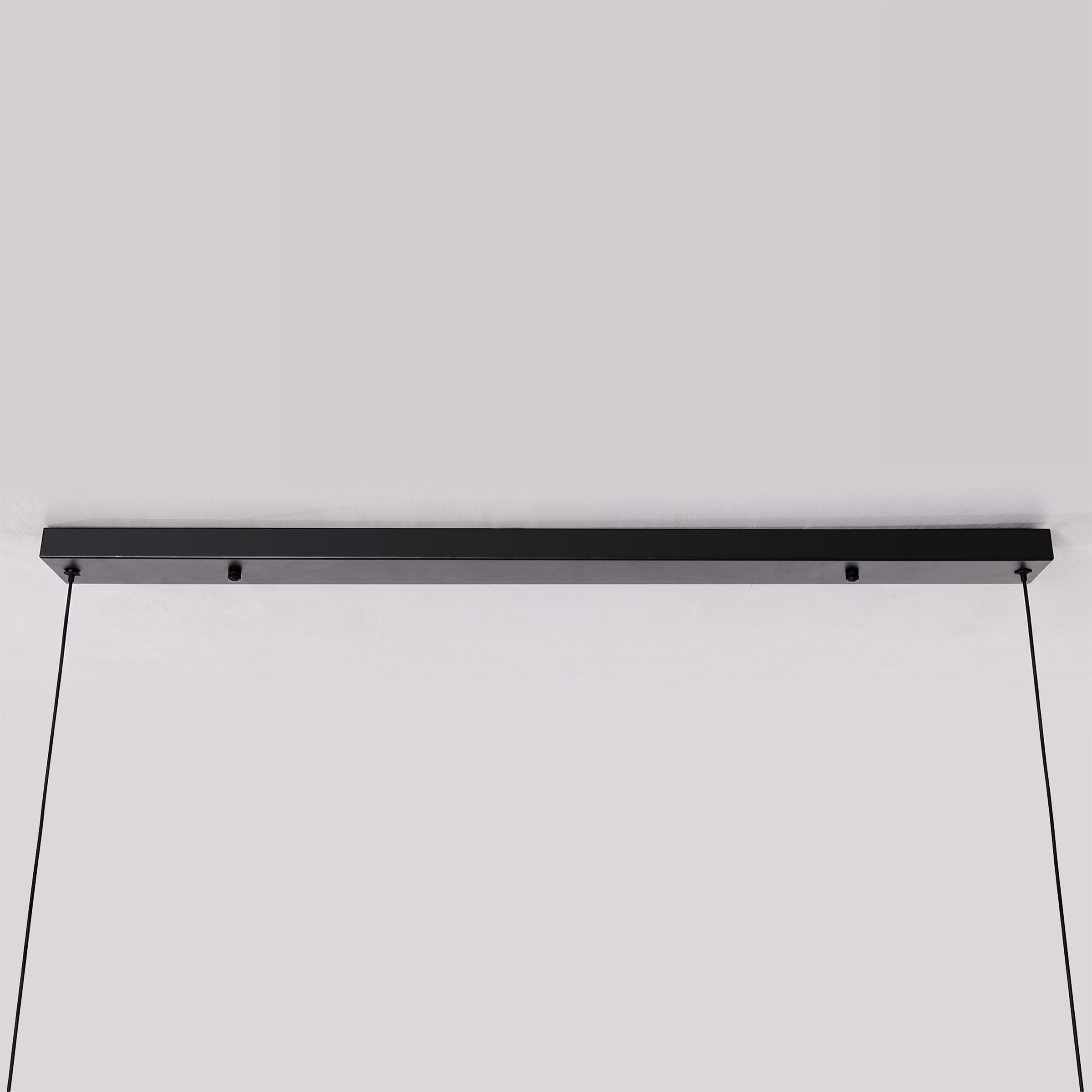 3-light walnut iron bar pendant beside a cosy seating area