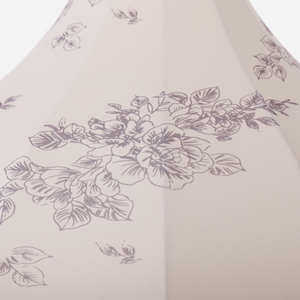 yellow floral fabric pendant light hung above a dining table