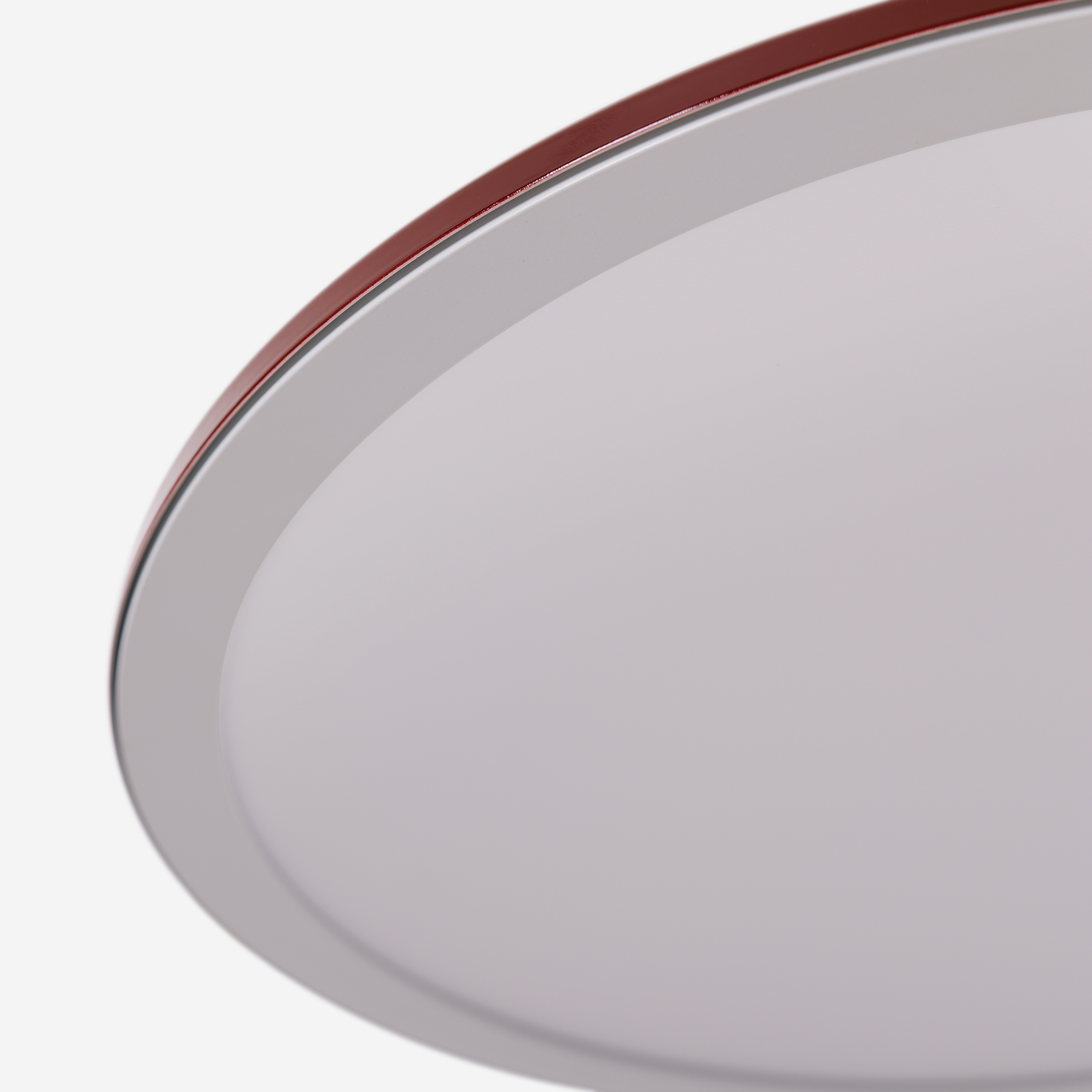 red iron pendant light styled in a calm bedroom