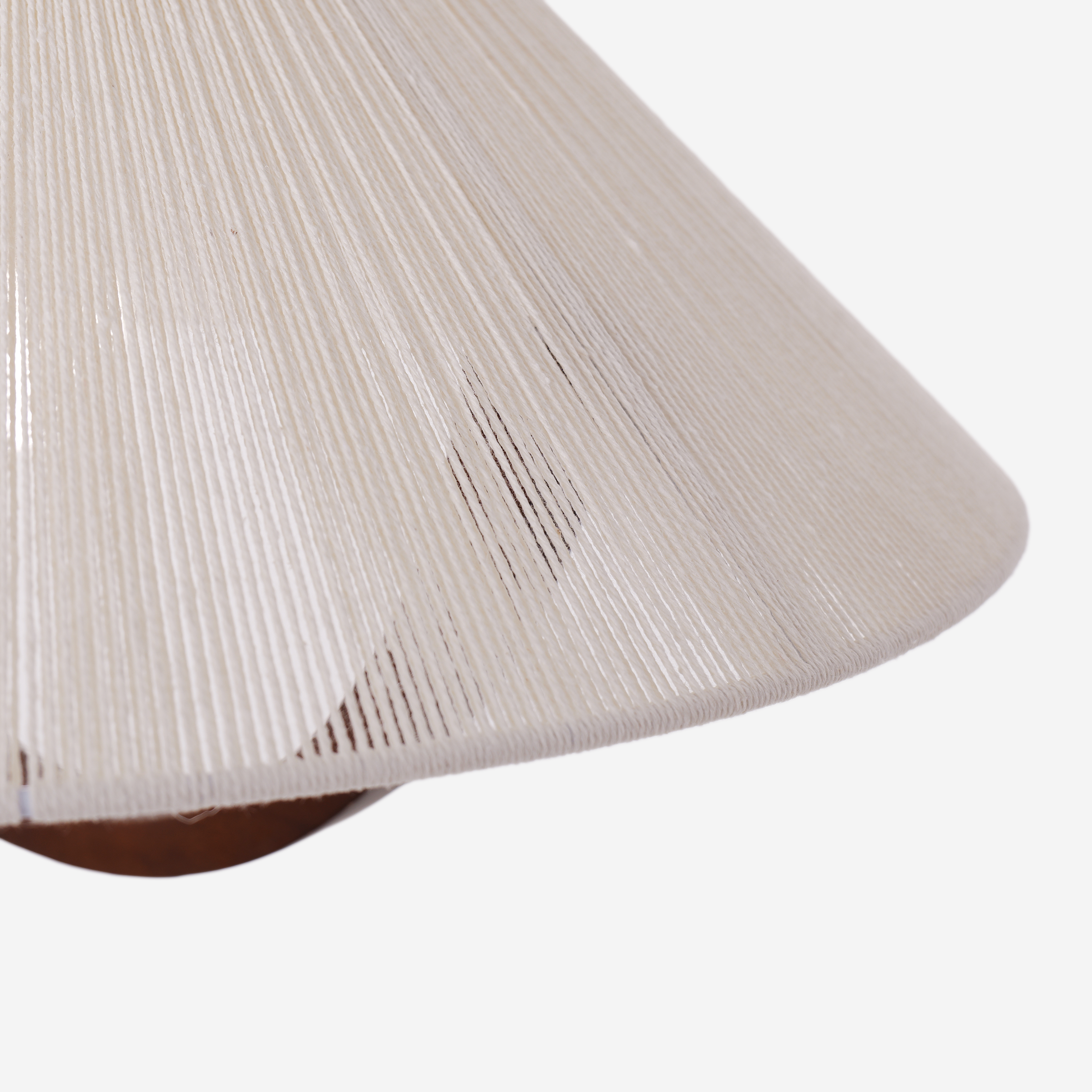 natural wood curved pendant light hung above a dining table