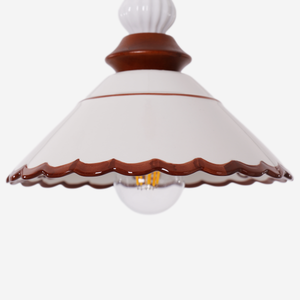 brown ceramic lace pendant light adding warm light to a dining space