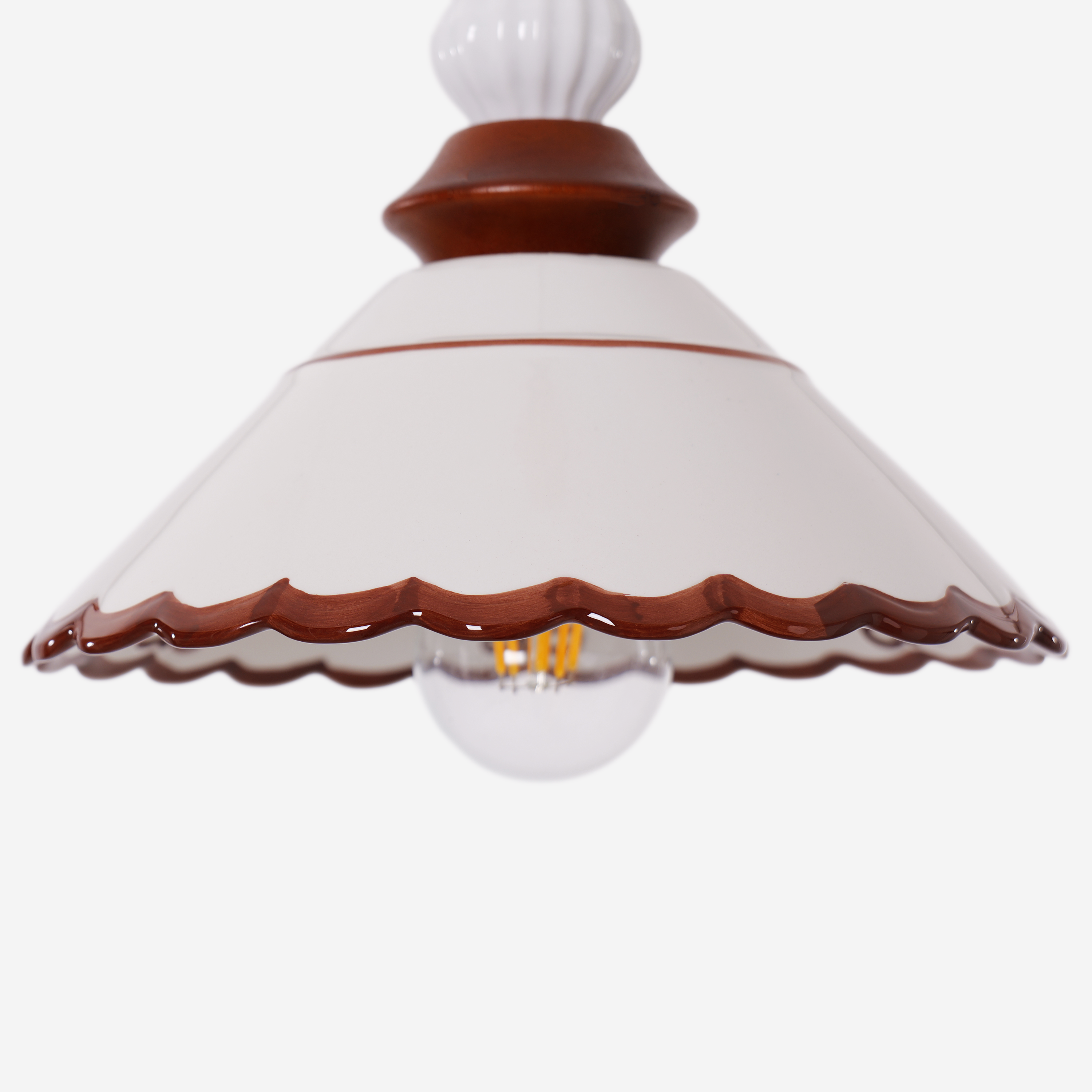 brown ceramic lace pendant light adding warm light to a dining space