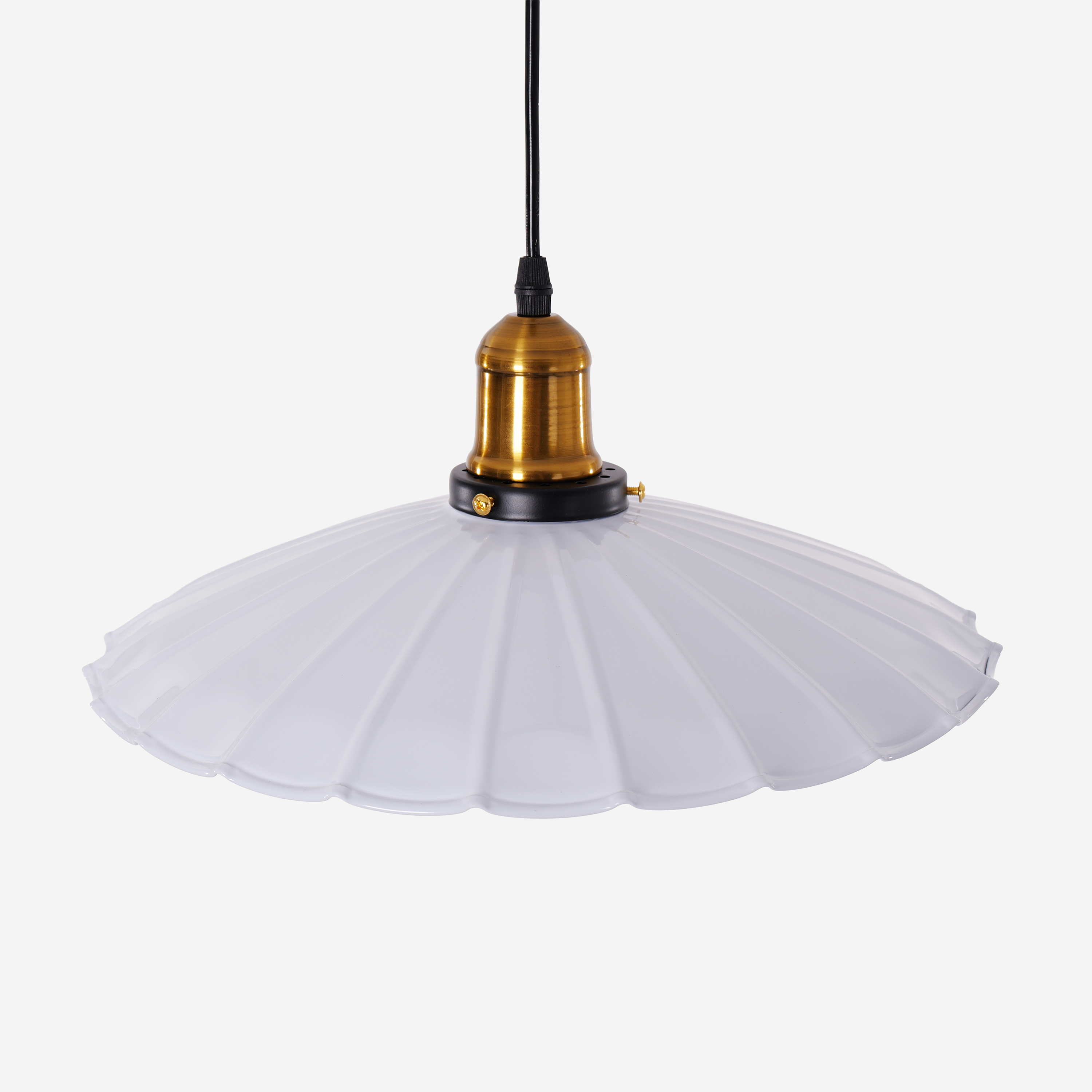 white iron pendant light adding warm light to a dining space