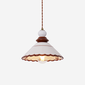 brown ceramic lace pendant light styled in a calm bedroom