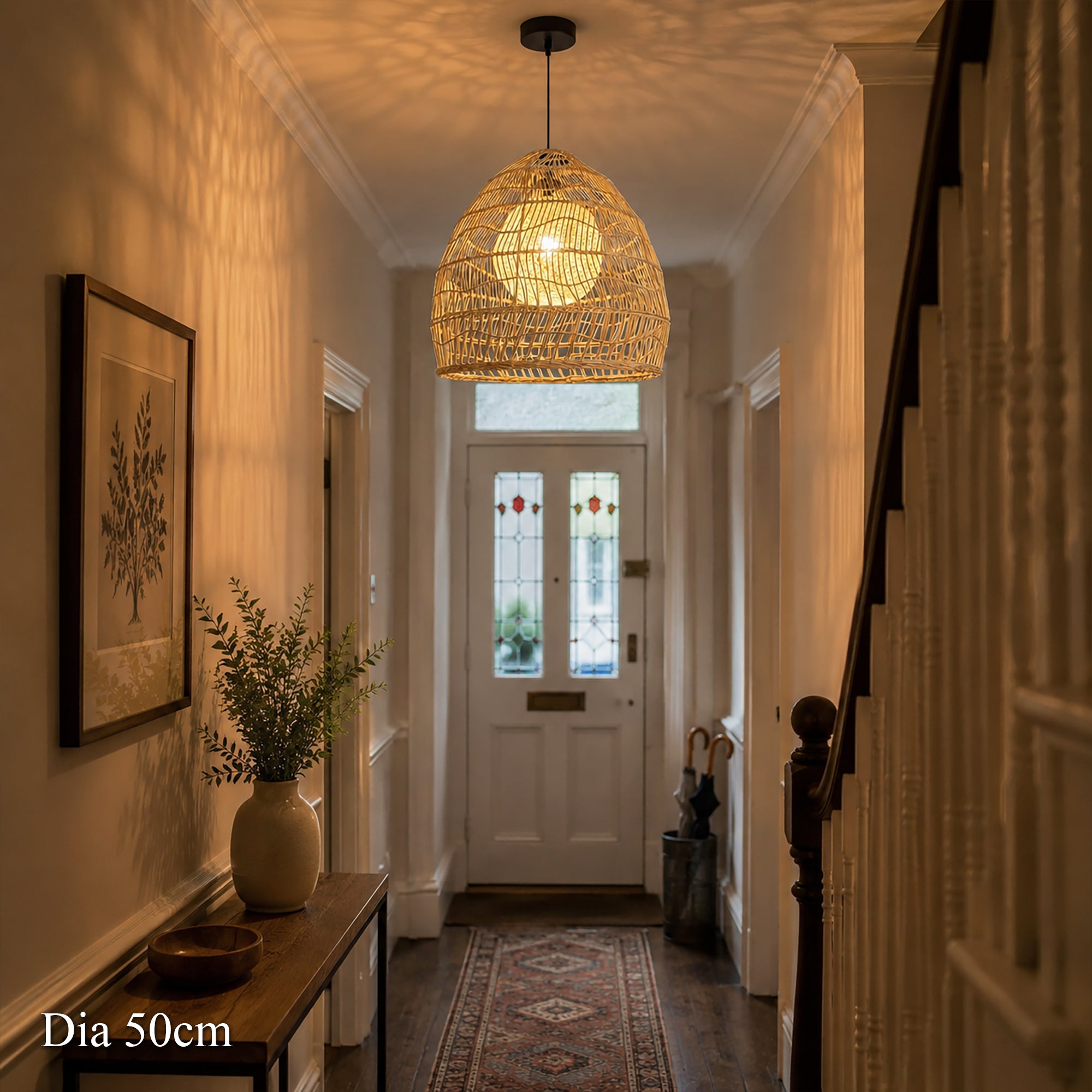 50cm rattan pendant light with inner sphere glowing in a hallway