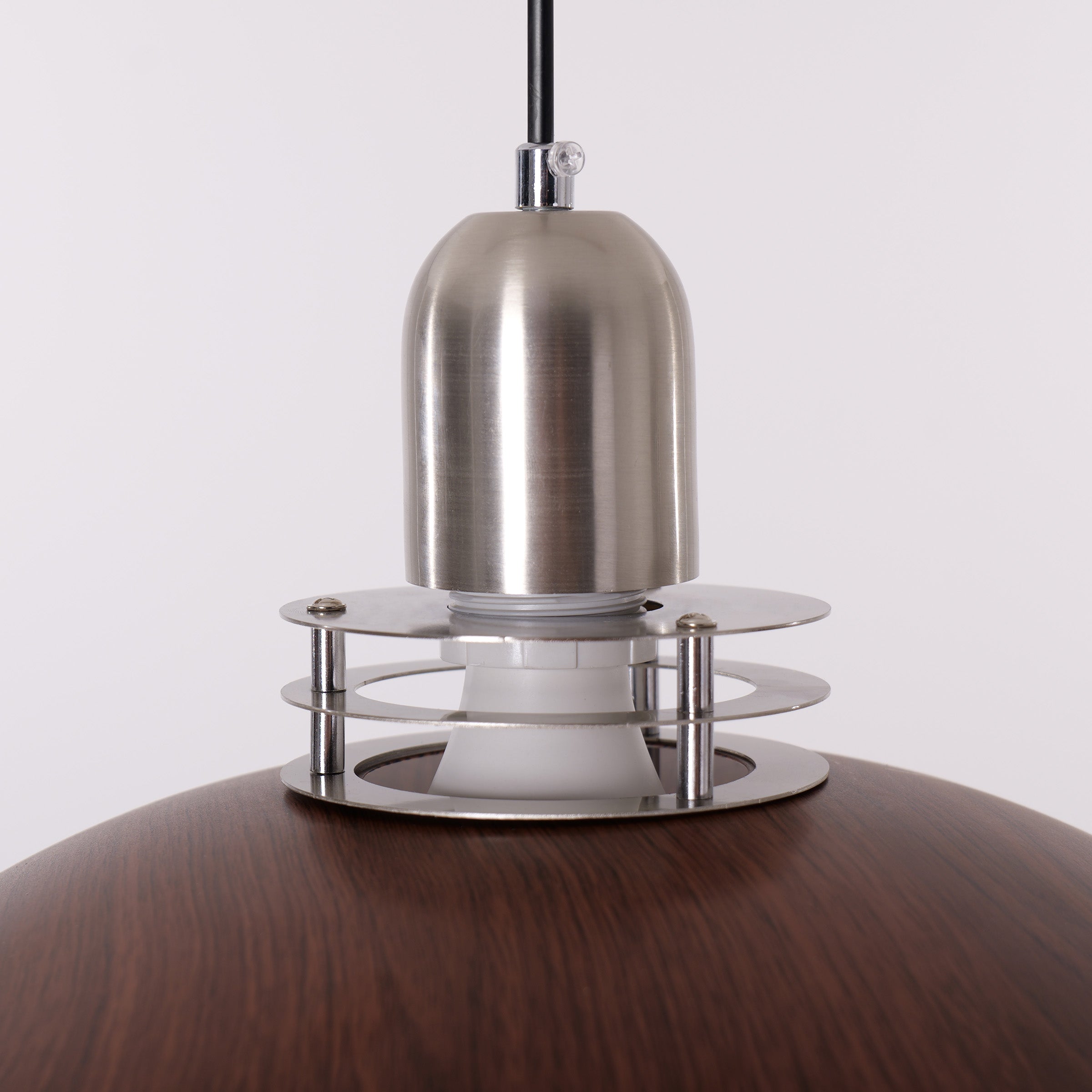 3-light walnut iron bar pendant hung above a dining table