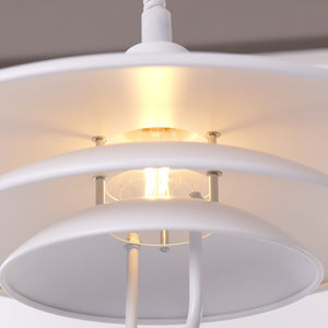 white layered minimalist pendant light styled in a calm bedroom