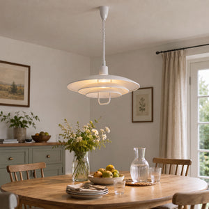 white layered minimalist pendant light over a kitchen island