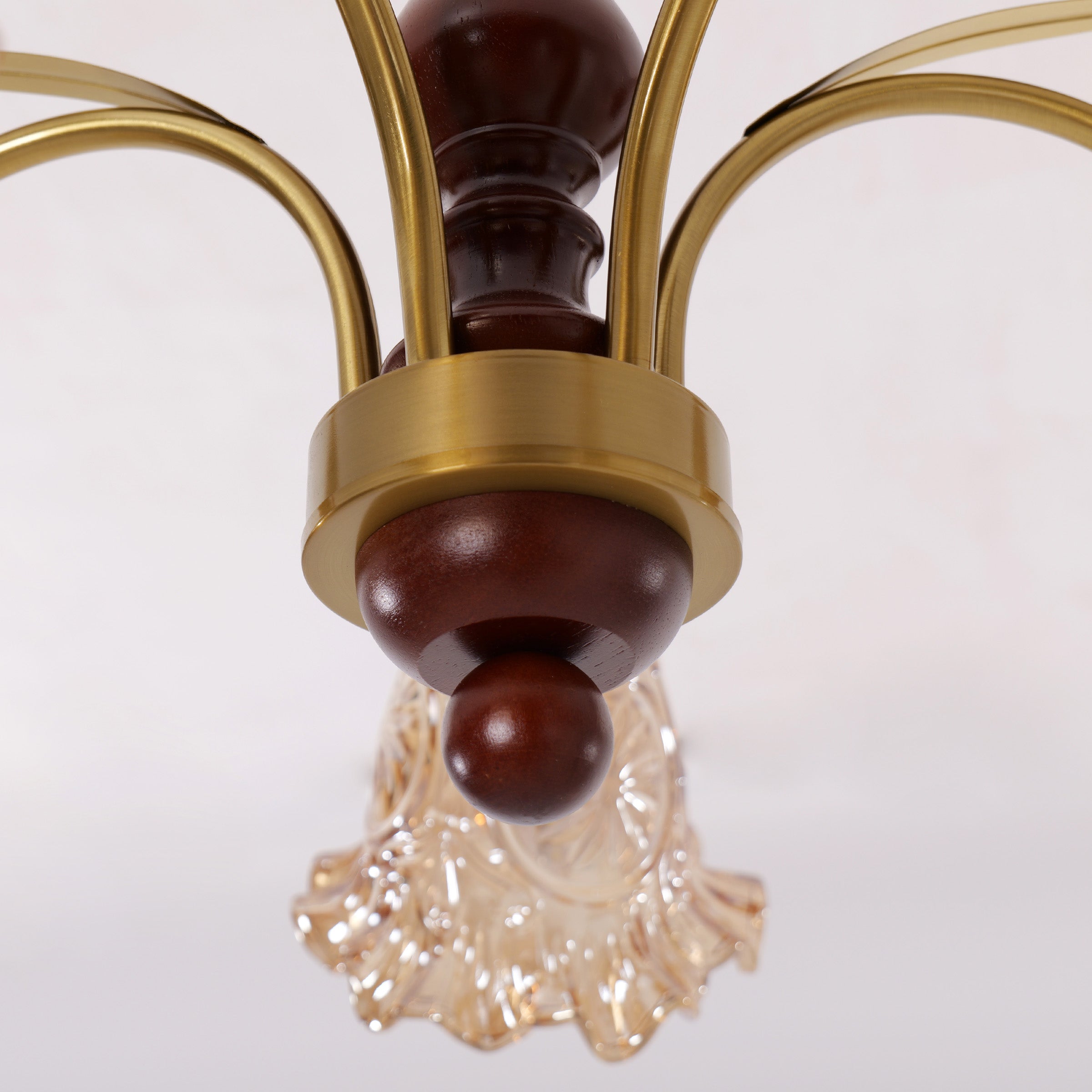 5-light copper chandelier with flower glass shades in an elegant lounge setting