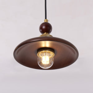 3-light walnut wood mini pendant over a kitchen island