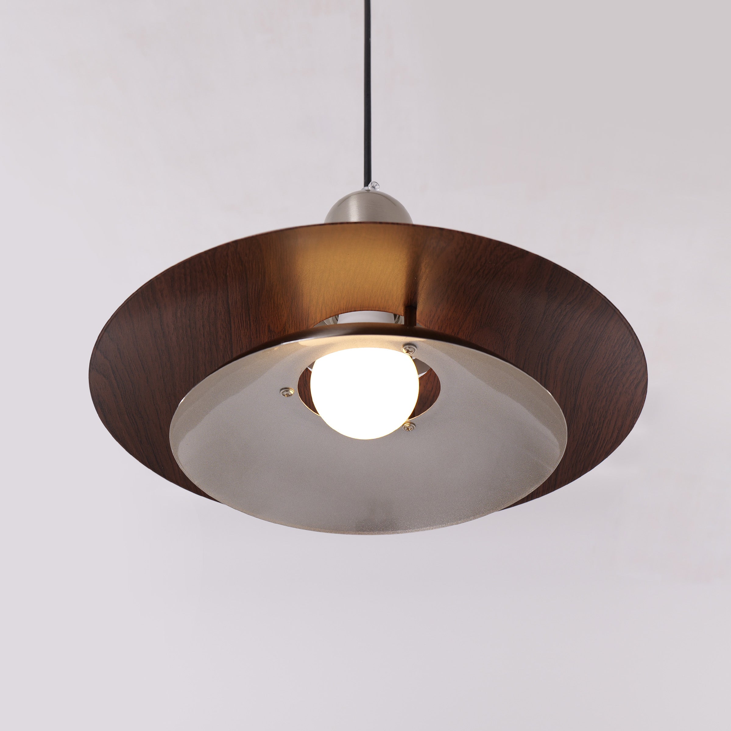 3-light walnut iron bar pendant over a kitchen island