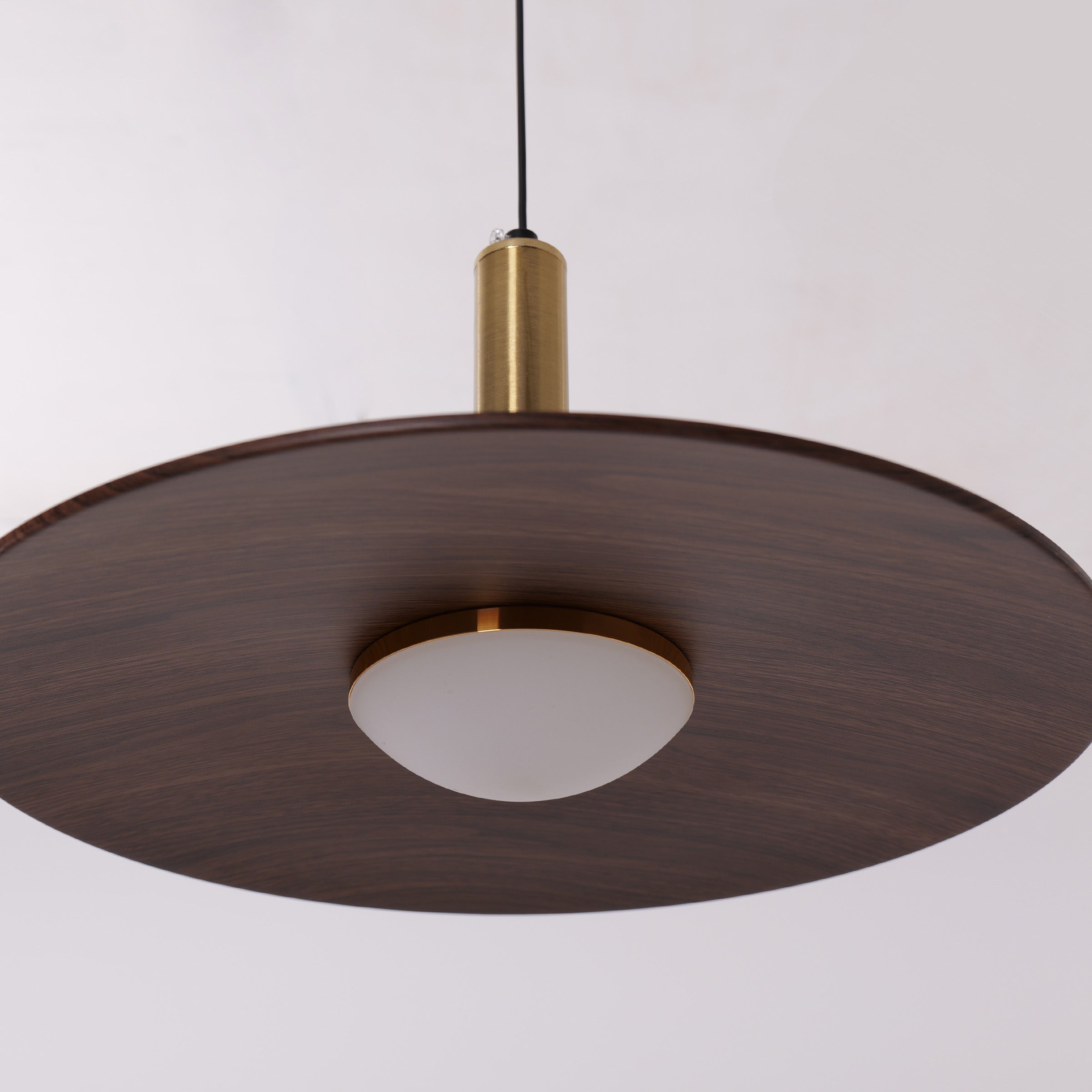 walnut double pendant light styled in a calm bedroom