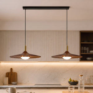 walnut double pendant light hung above a dining table