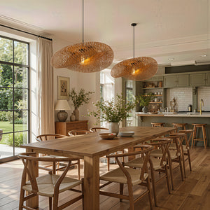 two bamboo pendant lights above a dining table in an open kitchen