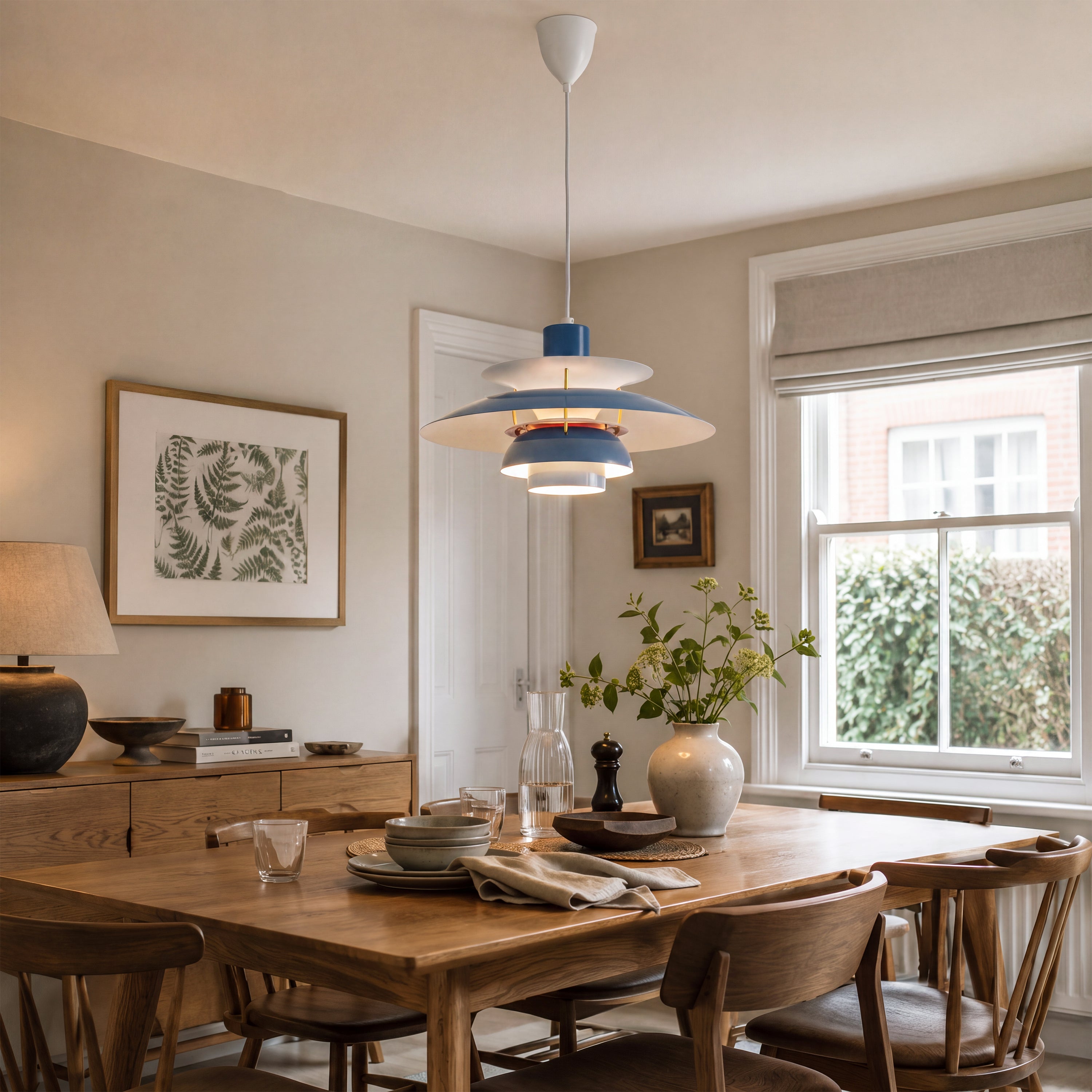 blue layered minimalist pendant light over a kitchen island