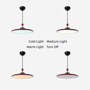 red iron pendant light over a kitchen island