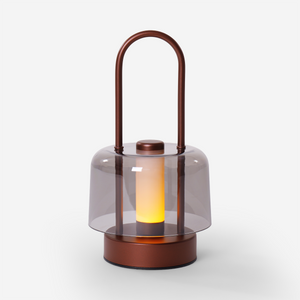 portable lantern-style ambient table lamp styled on a small side table
