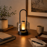 portable lantern-style ambient table lamp beside books and evening decor