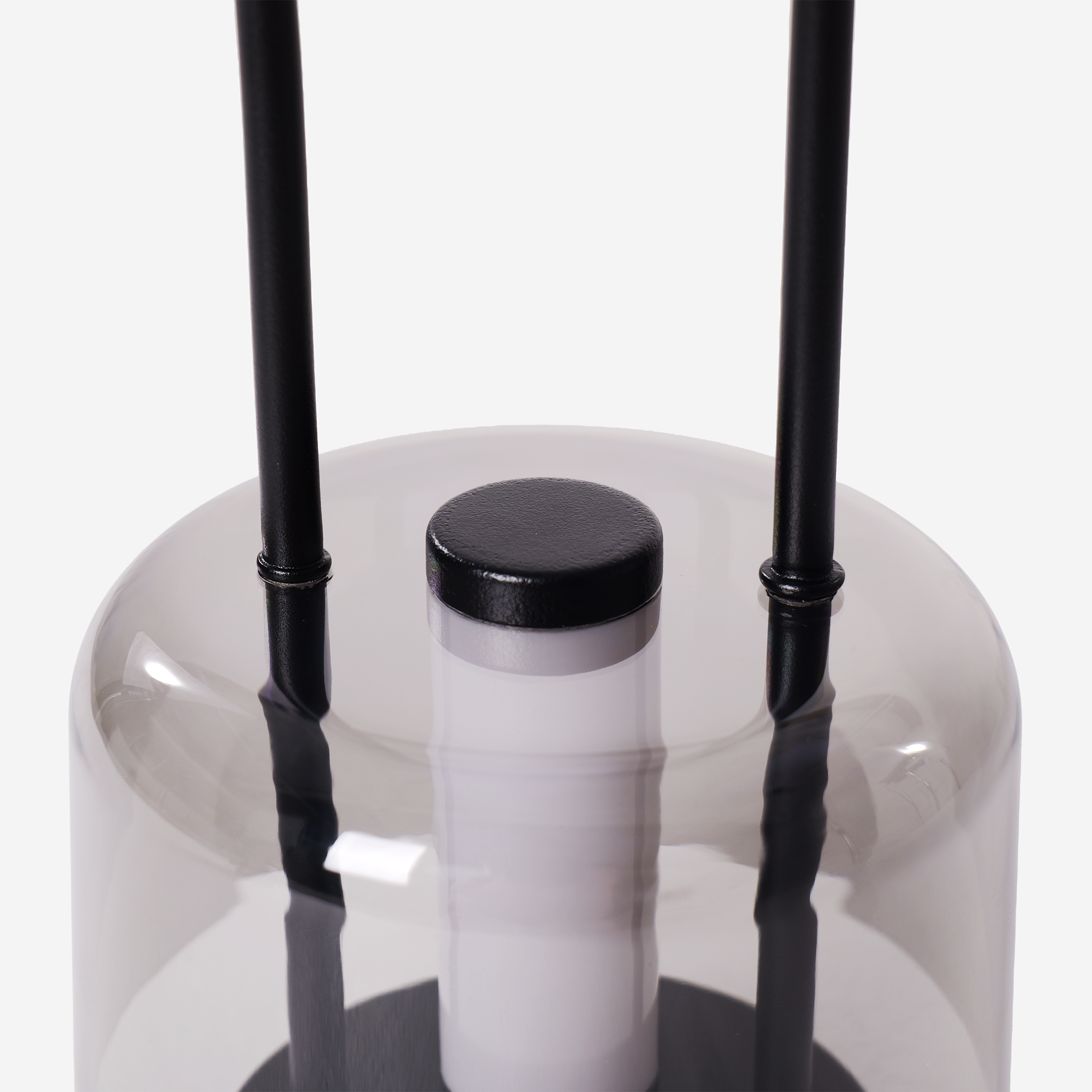 portable lantern-style ambient table lamp adding warm light to a bedroom