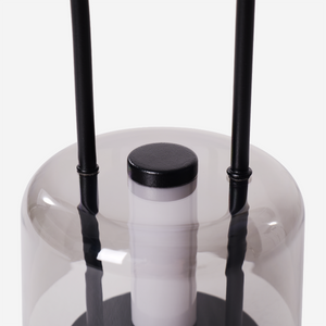 portable lantern-style ambient table lamp adding warm light to a bedroom