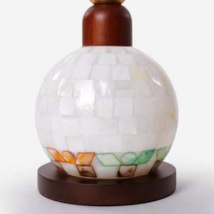 mother-of-pearl mosaic table lamp styled on a small side table