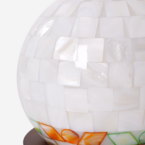 mother-of-pearl mosaic table lamp with a warm diffused glow
