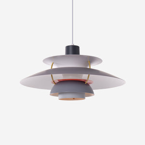 white layered minimalist pendant light over a kitchen island