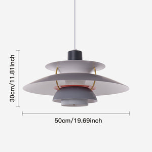 white layered minimalist pendant light beside a cosy seating area