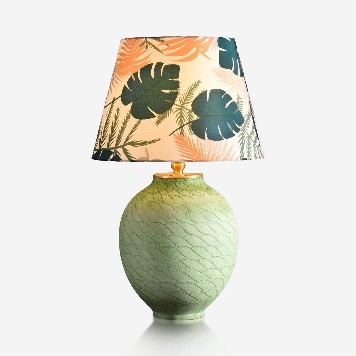 Green wave ceramic table lamp with colourful tropical leaf-print shade