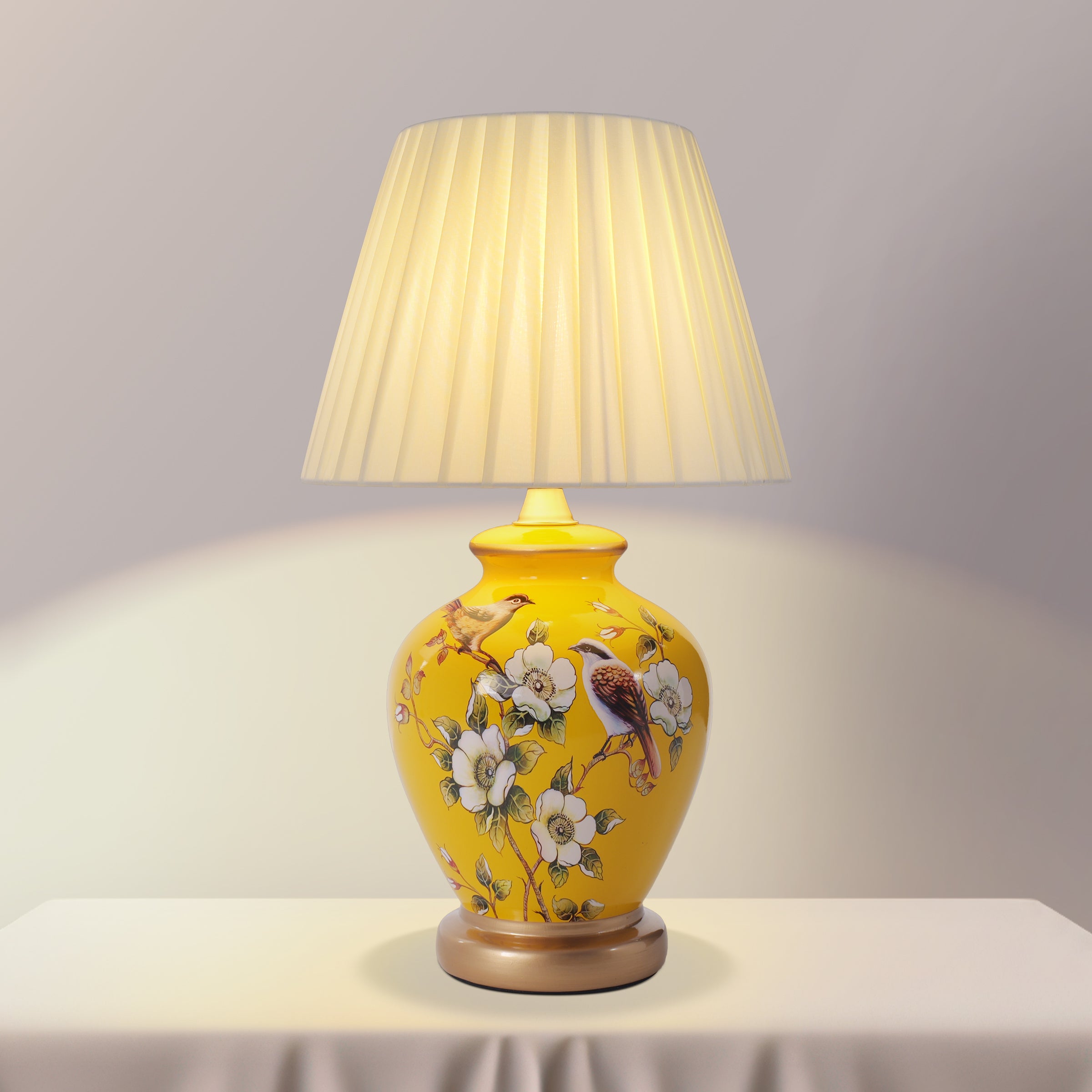 Yellow-Double Bird Chinoiserie Hand-Painted Ceramic Table Lamp table lamp shown lit with warm