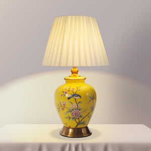 Yellow-Single Bird Chinoiserie Hand-Painted Ceramic Table Lamp table lamp shown lit with warm