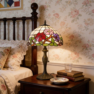 Tiffany Table Lamp Handcrafted Stained Glass Floral Petals Red, Pink and table lamp on a bedroom bedside